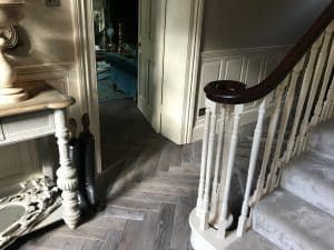 Grey parquet herringbone flooring