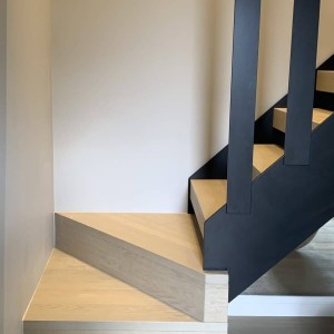 Open rise stair with painted steel vertical slats Open rise stair with painted steel vertical slats