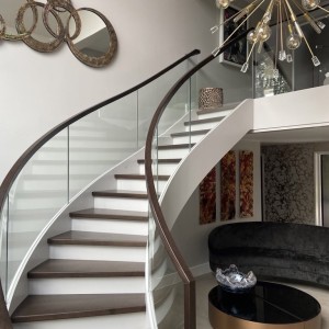 Helical staircase with inset frameless glass balustrade closed rise Helical staircase with inset frameless glass balustrade closed rise
