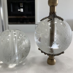 Hand etched glass orbs with feature bronze flowers for a balustrade Hand etched glass orbs with feature bronze flowers for a balustrade
