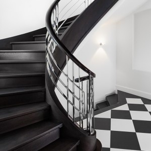 Monochrome styled balustrade and closed riser helical staircase Monochrome styled balustrade and closed riser helical staircase
