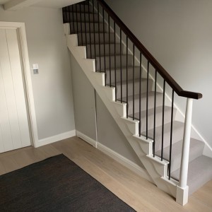 Traditional cut string oak staircase with feature iron spindles and bespoke oak handrails Traditional cut string oak staircase with feature iron spindles and bespoke oak handrails