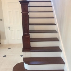 Staircase renovation with new oak treads with walnut finish and white risers Staircase renovation with new oak treads with walnut finish and white risers