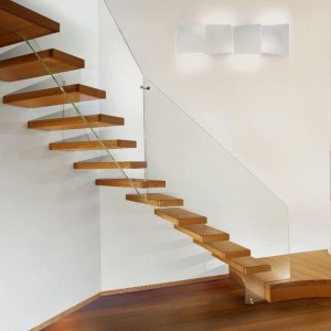 Floating staircase feature first tread and frameless glass with oak covers Floating staircase feature first tread and frameless glass with oak covers