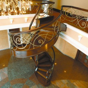 Helical spiral staircase hand forged patinated iron balustrade Helical spiral staircase hand forged patinated iron balustrade
