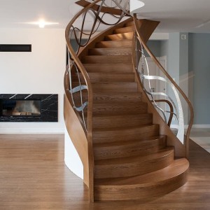 Helical oak staircase closed riser, feature hand forged iron balustrade
