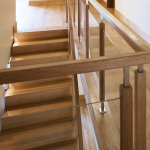 Contemporary oak posts with inset glass and oak handrail Contemporary oak posts with inset glass and oak handrail