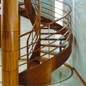 Helical spiral staircase in oak with oak elliptical horizontal rails and stainless steel balustrade Helical spiral staircase in oak with oak elliptical horizontal rails and stainless steel features