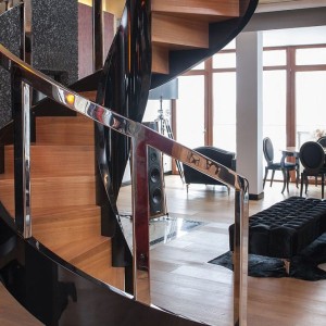 Helical spiral stair closed rise with piano black helical banding and polished balustrades Helical spiral stair closed rise with piano black helical banding and polished balustrades