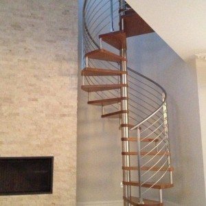 Oak spiral staircase with 8 traversal stainless rods and newel posts Oak spiral staircase with 8 traversal stainless rods and newel posts