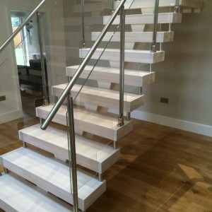 Central Spine staircase Whitened treads with stainless steel and glass balustrade Central Spine staircase Whitened treads with stainless steel and glass balustrade
