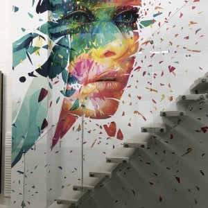 Floating resin staircase with feature face mural as wall art Floating resin staircase with feature face mural as wall art