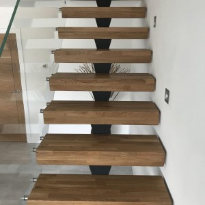 Central Spine staircase with Ultra clear frameless glass balustrade Central Spine staircase with Ultra clear frameless glass balustrade