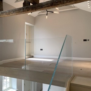 Frameless glass balustrade that floats out from the floor Frameless glass balustrade that floats out from the floor